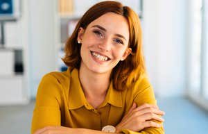 gen z woman smiling putting her life skills to use