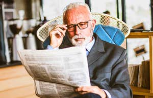 People From The 60s And 70s Had 10 Old-School Hobbies That Protected Their Peace older man reading a newspaper feeling nostalgic for the past