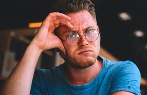 annoyed man feeling bored during conversation