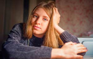 sad serious woman who grew up in tough financial times
