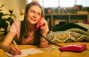 People Did Things On An Average Friday Night In The 1990s That Genuinely Protected Their Mental Health 1990s teenager on the phone making friday night plans