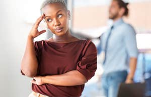Woman with class considers how to tell a man at work to mind his business