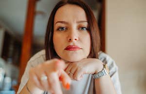 how a person acts when they're jealous says a lot about their emotional intelligence jealous woman pointing at viewer