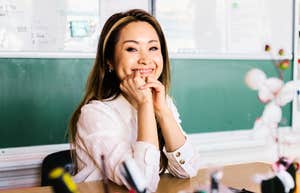 Smiling at her desk in front of the chalkboard, this teacher is easy to picture as someone worth getting to know.