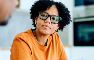 things people start to feel numb toward when they have compassion fatigue Woman who looks fatigued listening to a man talk