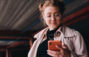 woman texting on phone