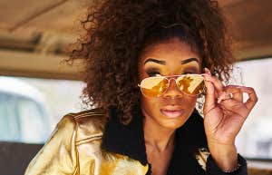 girl pulling down sunglasses