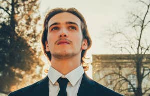 man in suit and sun set