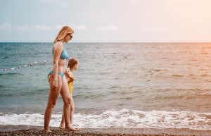 mom with daughter at beach