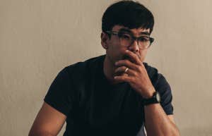 man sitting alone thinking