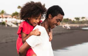 No, My Kid Doesn’t Have "Good Hair" Black girl riding piggyback on back of Black boy