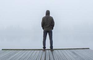 man standing alone on dock