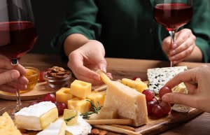 grabbing cheese from cheese board
