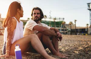 couple chatting on the beach