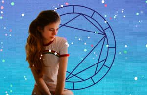 10 Bad Zodiac Placements In The Birth Chart woman in front of birth chart