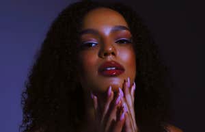 pretty girl with makeup and long nails