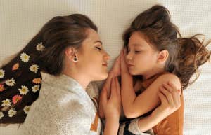 mom and daughter with flowers in hair 