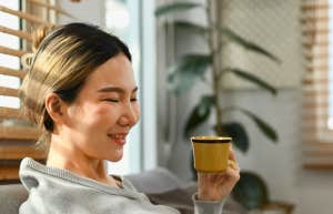 woman on couch smiling