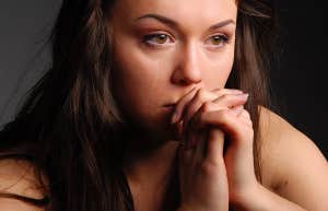 sad woman praying