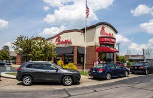 Chick-Fil-A with long line of cars in the drive-thru