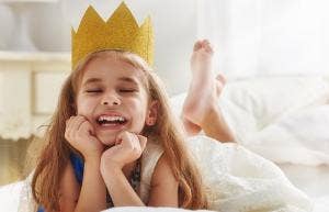toddler girl with crown on head