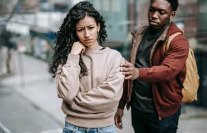 distressed woman being comforted by man
