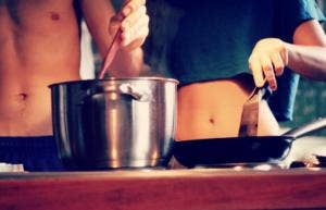 couple cooking food together