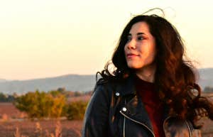 Why You Need To Stop Looking For Signs And Start Creating Your Own woman in a field