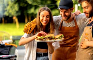 woman at a bbq with two men