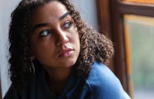 woman looking out the window