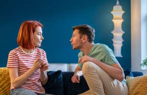 immature man talking to woman