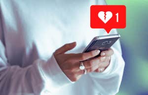 heartbreak icon coming from phone woman texting