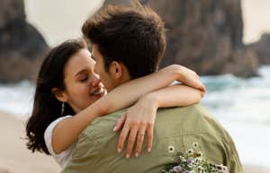 couple hugging on the beach