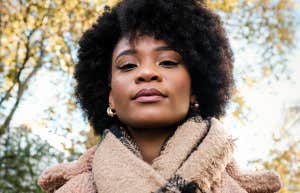 woman wearing scarf outside under trees