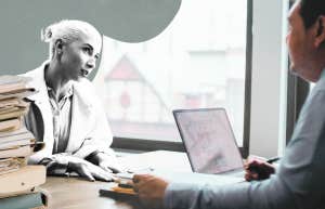Woman meeting with a divorce lawyer, with paperwork 