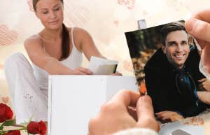 Woman putting photos into a box sadly