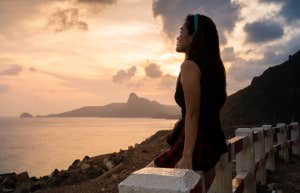 Read This If You Feel Like Your Heart Can't Take It Anymore woman looking at sunset