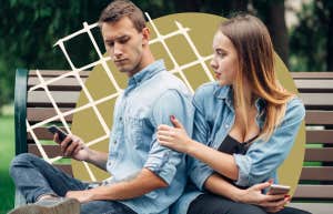 man on his phone while woman pleads for attention