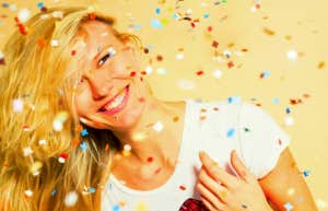 happy woman surrounded by confetti