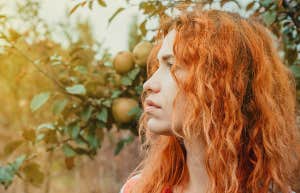 girl with red hair outside