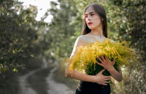 woman holding flowers