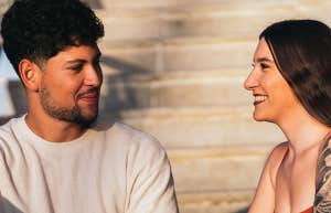 guy and girl sitting on steps chatting
