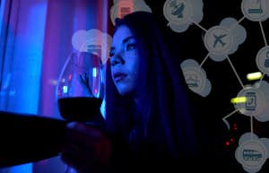 Woman drinking wine and spying on exs social media 