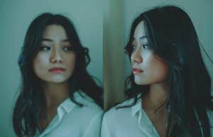 5 Tiny-But Clear Signs Your Relationship Is Totally Over Woman staring at reflection