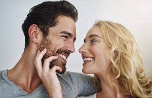 happily married couple smiling at each other