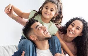 parents playing with daughter