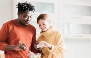 couple breaking eggshells together