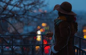 woman alone on dark evening in winter