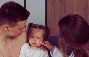 parents comforting child