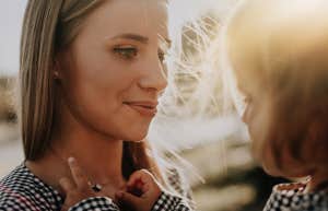 mother holding young daughter